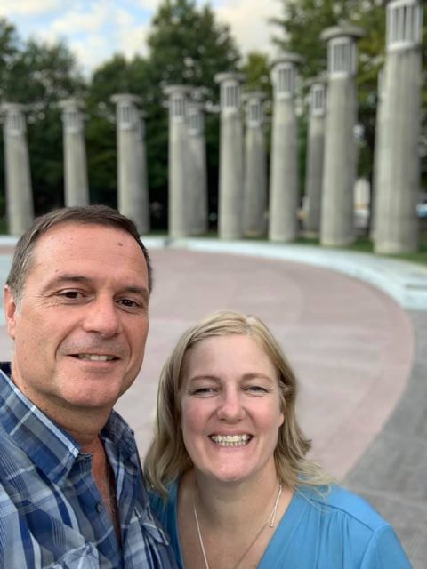 author and husband standing in front of carillon at Bicentennial Capitol Mall State Park in Nashville, Tennessee