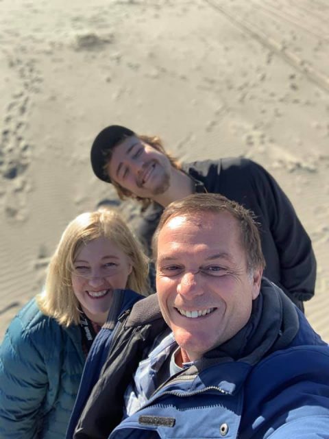 author with son and husband at the beach in Long Beach, WA