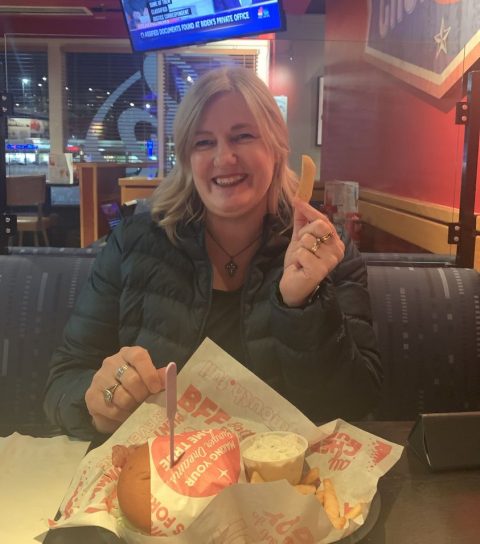 Author celebrating her birthday at Red Robin with burger and fries